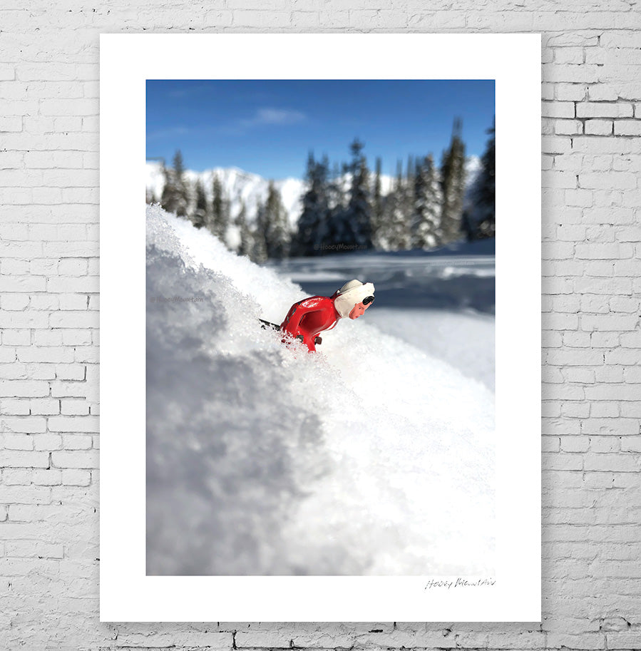 Vintage Toy SKier in deep powder on steep run .  photo by Hooey Mountain