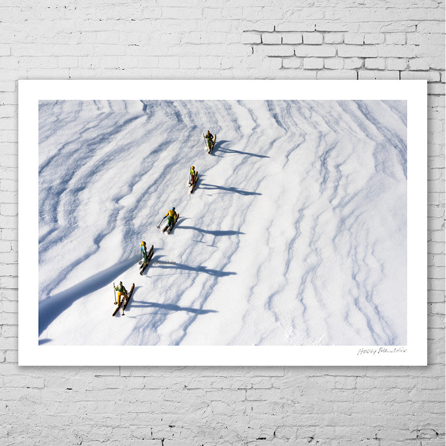 Antique toy skiers and their long shadows by Hooey Mountain