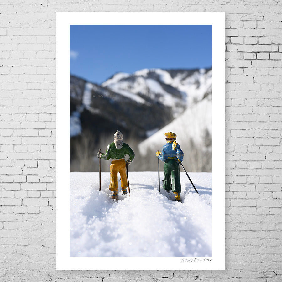 Antique toy skier couple in snow by Hooey Mountain