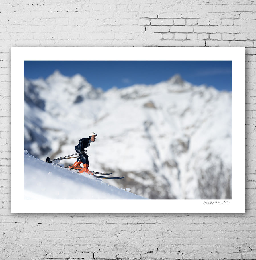 Antique toy skier in big alpine setting by Hooey Mountain