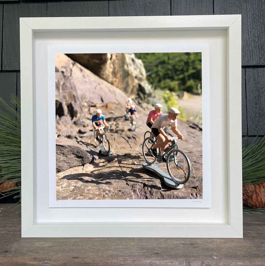 Toy bikers riding up a mountain by Hooey Mountain