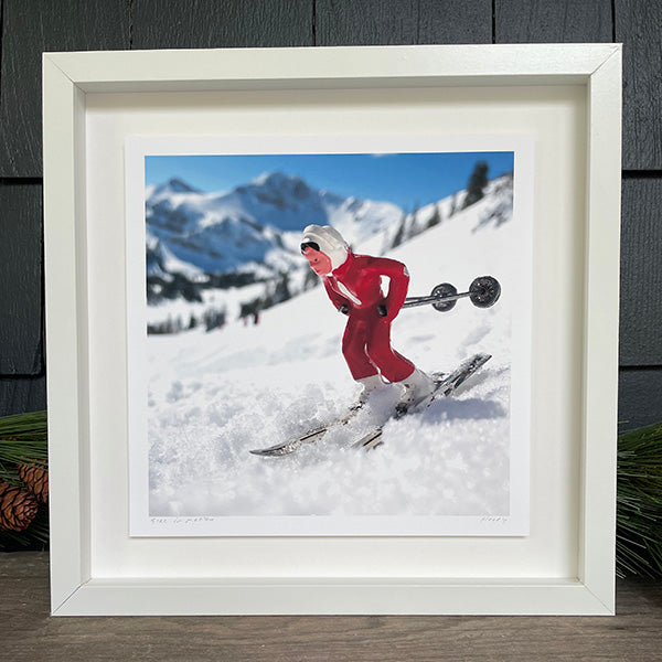 Floated image of Hooey Mountain toy skier in white frame