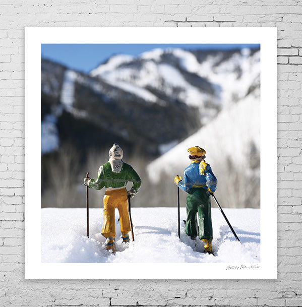 Two toy skiers on a day date by Hooey Mountain
