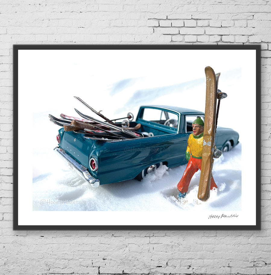 Photo of a vintage toy skier holding skies in a frame
